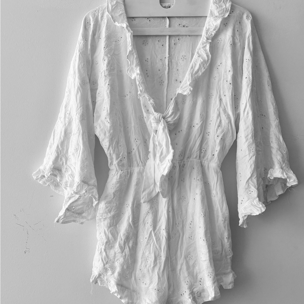 White eyelet romper ruffle bell sleeve flouncy low v tie front rayon romper